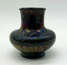 A Pilkington`s Lancastrian pottery green lustre glazed vase with blue flower decoration by Gwladys