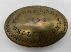 A Victorian brass snuff box named to John L Fry, Wellington, 1899