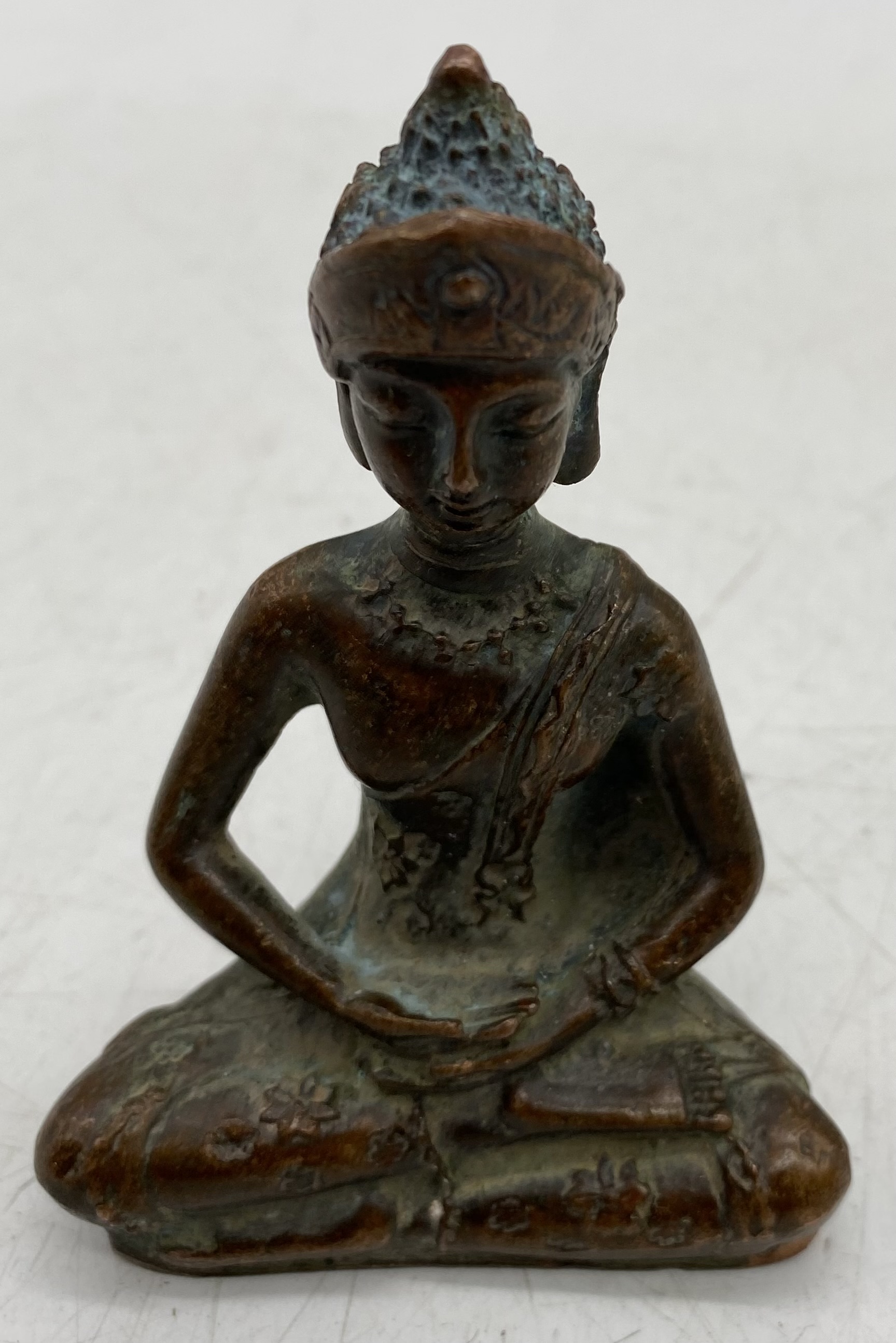 A seated bronze figure of Tibetan Buddha, height 8.75cm