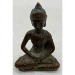 A seated bronze figure of Tibetan Buddha, height 8.75cm