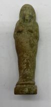 An Egyptian green faience Shabti with hieroglyphs to reverse, height 7.3cm