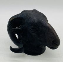 A bronze wall mount in the form of ram's head - height 16cm