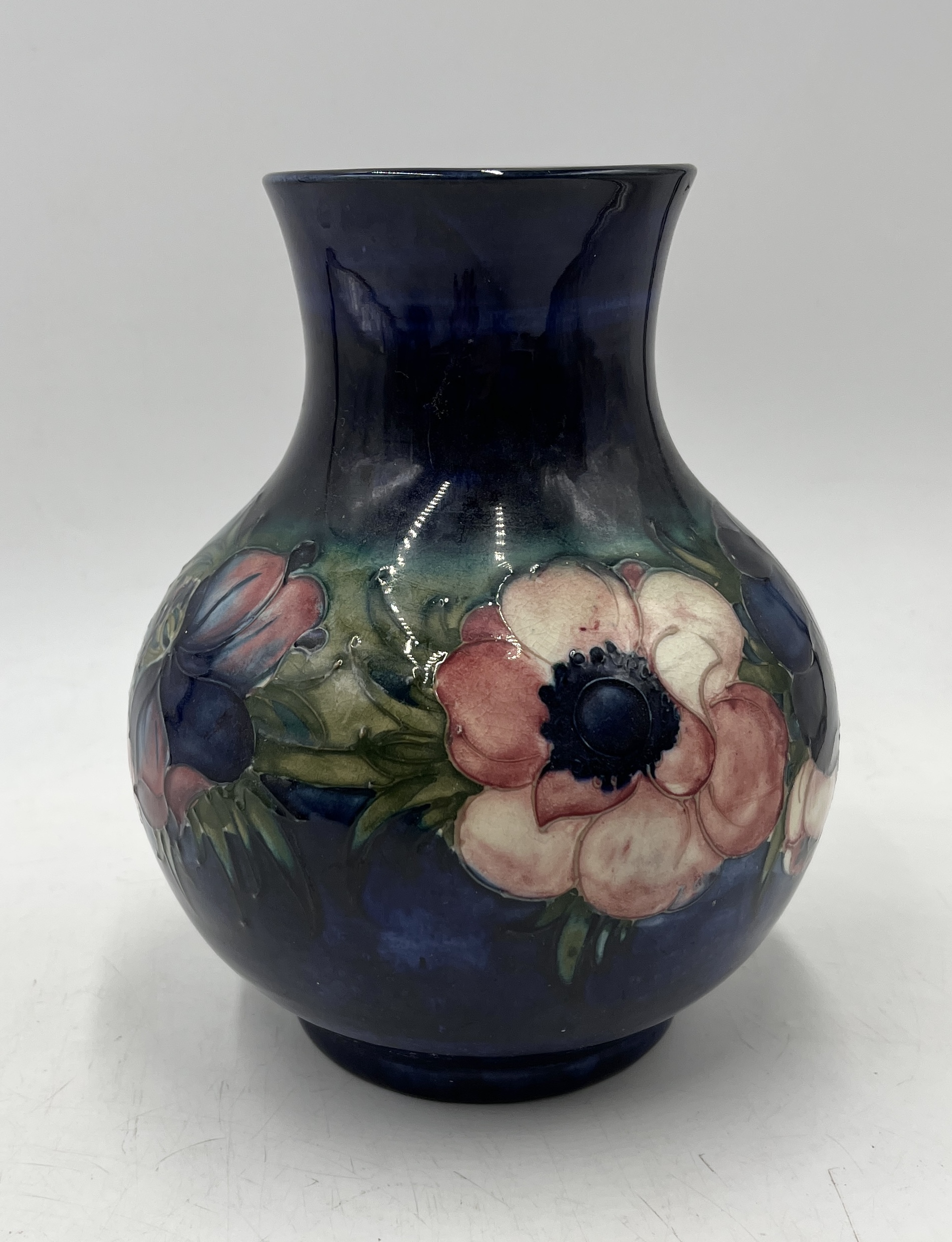 A Moorcroft vase in the Anemone pattern, signed to base and impressed "Potter to H.M. The Queen" - - Image 2 of 4