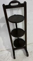 A vintage wooden three tier cake stand