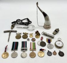 A collection of interesting items including Pakistan army service medals, ACME Scout Master