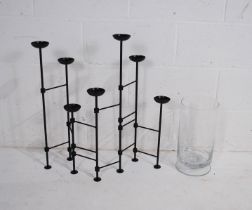 A wrought iron folding candelabra, along with a Villeroy and Boch glass vase