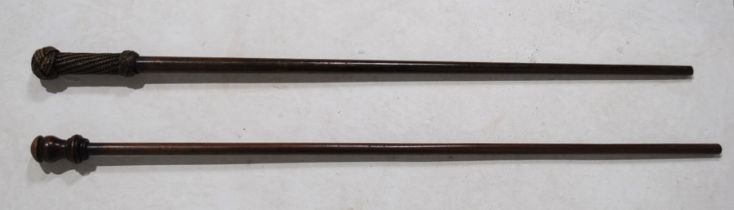 Two antique walking sticks, one with a carved rope effect handle, possibly Naval