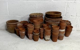 A quantity of terracotta pots, over two boxes.