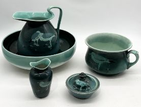 A Royal Doulton green glazed jug and bowl set decorated with seagulls includes jug, bowl, chamber