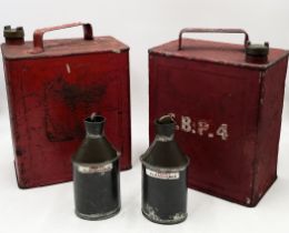 A small collection of vintage petrol cans