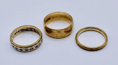 Two 9ct gold wedding bands along with a 9ct gold eternity ring, total weight 9g