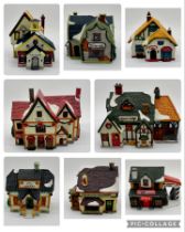 A collection of Lemax Christmas village/village collection houses etc some boxed, some with light