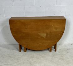 A mid-century G-plan drop leaf dining table