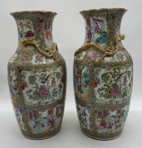 A pair of large 19th century Famille Rose vases each with frilled rims and gilded dragon to