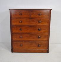 A large Victorian mahogany chest of six drawers, raised on flattened bun feet - length 120cm,