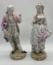 A large pair of Meissen style porcelain figures of a gallant and companion, he wearing a pink