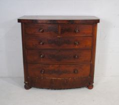 A Victorian mahogany bow-fronted chest of five drawers, raised on ball feet, A/F - length 118cm,