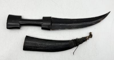 An antique wooden handled Jambiya with leather sheath