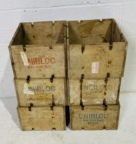 A set of six Unibloc wooden crates