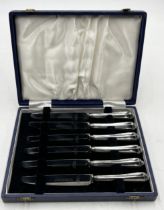 A cased set of silver handled knives