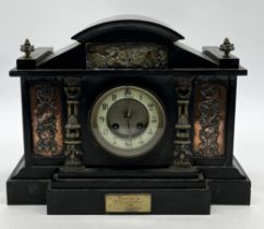 A late 19th century slate mantle clock with inset decorated copper panels and movement by A.D.