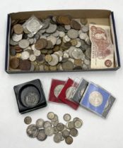 A collection of various coinage including some silver
