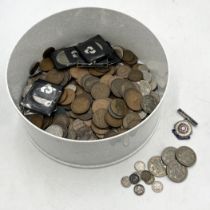 A collection of various coinage including a small quantity of silver