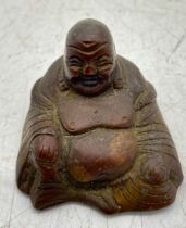 A small seated bronze figure of Buddha, height 4.5cm