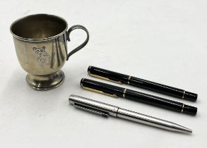 A collection of three parker pens including a Parker Rialto along with a silver plated christening