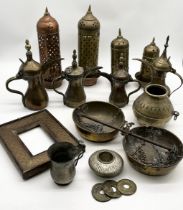 A collection of various Eastern brass including coffee pots, scales, weights, lanterns, pots etc.