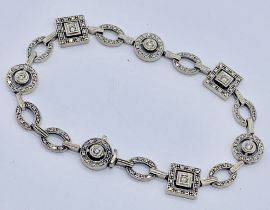 An 18ct white gold bracelet set with diamonds- 1 link removed for sizing but is present, total