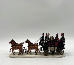 An unboxed Lemax, poly resin Christmas stage coach ornament.