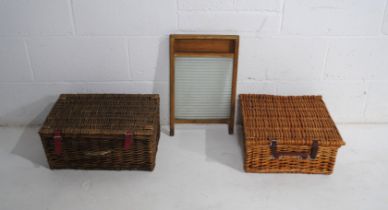 A vintage washboard along with two wicker hampers/baskets