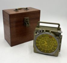 A vintage junior pigeon racing clock in wooden case