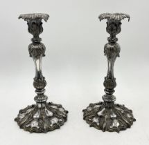 An Elkington & Co pair of silver plated candlesticks with acanthus moulded decoration throughout -