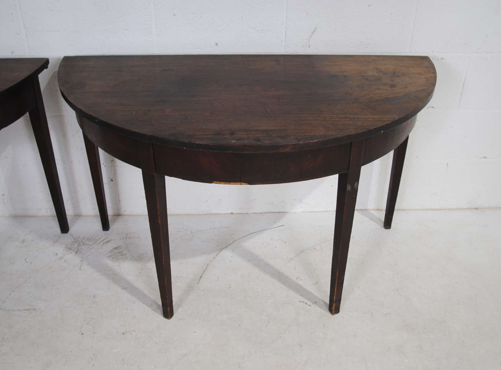A pair of Georgian mahogany demi lune tables, raised on tapering legs - Image 8 of 8