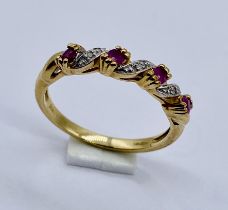 A ruby and diamond dress ring set in 9ct gold, size O