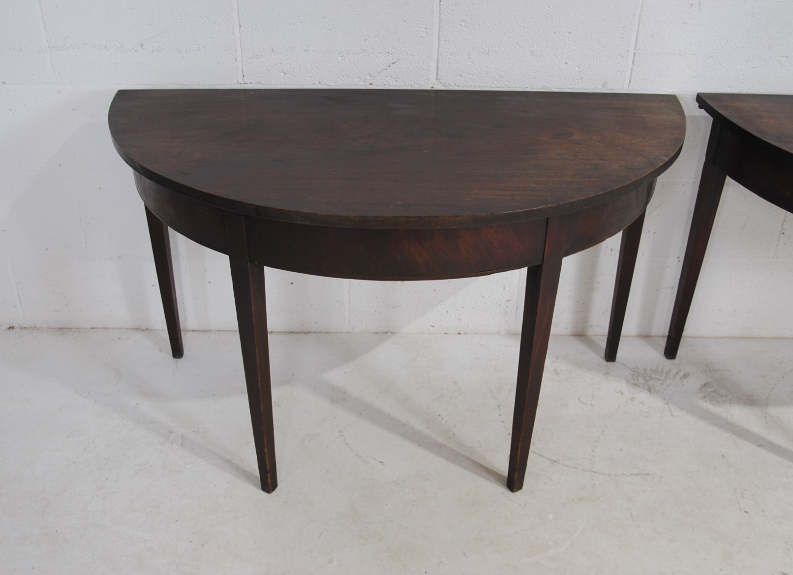 A pair of Georgian mahogany demi lune tables, raised on tapering legs - Image 7 of 8