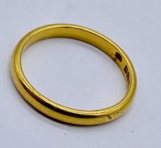 A 22ct gold wedding band, size J, weight 2.3g