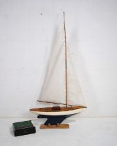 A large 'Futaba' remote control wooden pond yacht, with stand - length 93cm, height 184cm