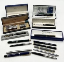 A collection of vintage pens including Parker, Sheaffer and Waterman