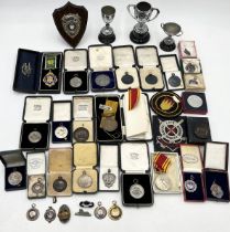 A large quantity of various medals and cups all awarded to J Berriman including 13 silver