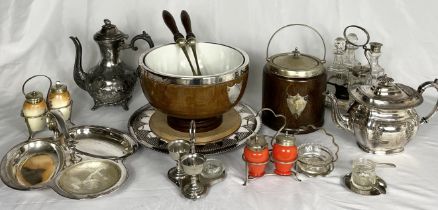 A collection of silver plated items, biscuit barrel, cheeseboard, condiment sets etc.