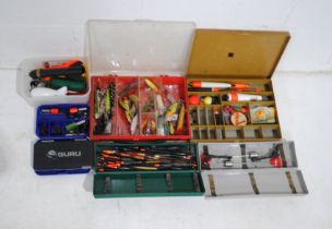 A quantity of various fishing tackle, including floats, lures - some by Shakespeare and Heddon etc.