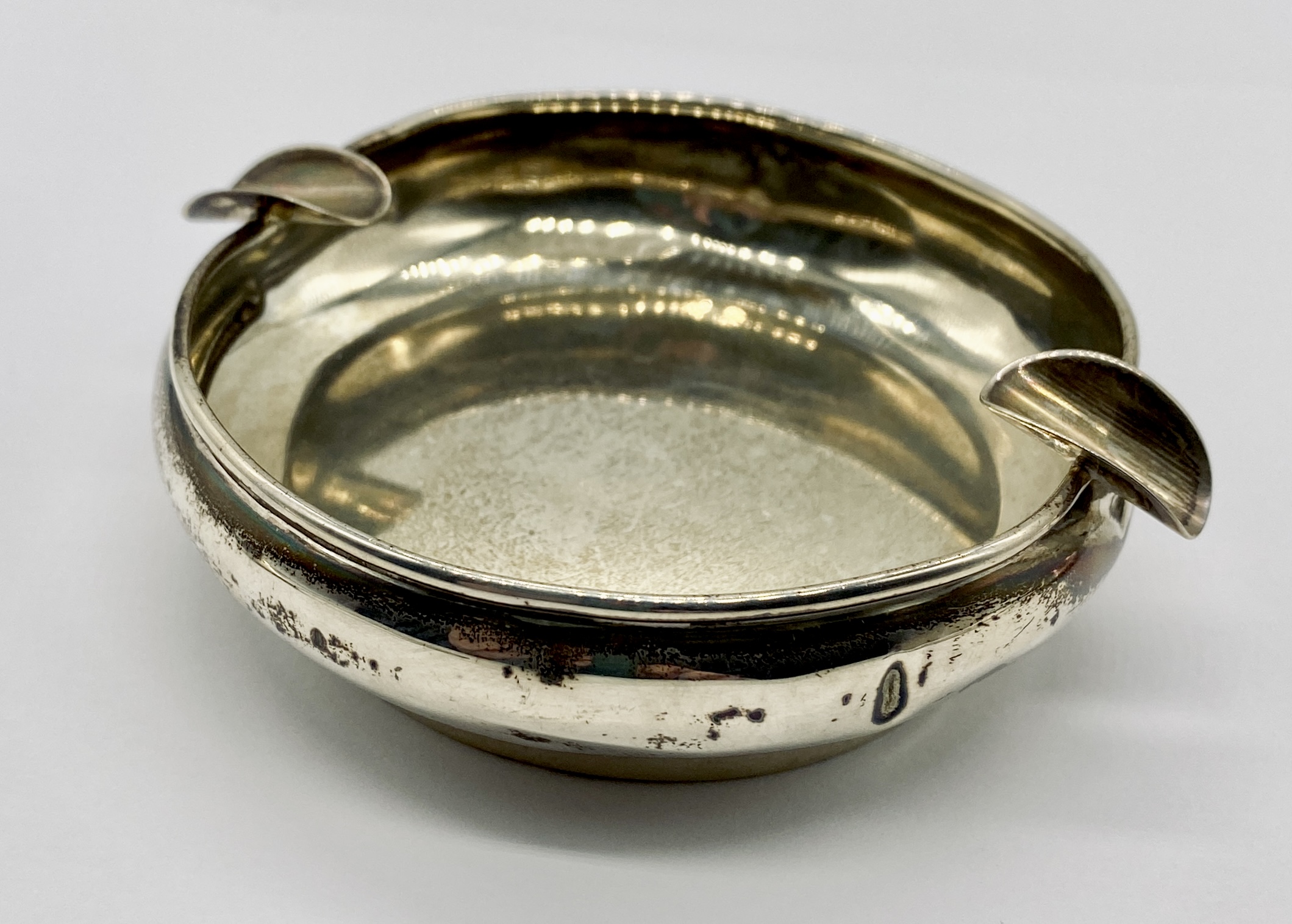 A silver weighted ashtray along with two silver spoons and a serviette ring - Image 2 of 4