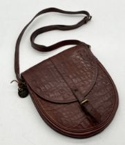 A Mulberry cross body leather "Saddle" bag with tartan interior and original tag with serial number