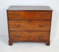 A Georgian mahogany chest of three graduating drawers, raised on bracket feet - length 100cm,