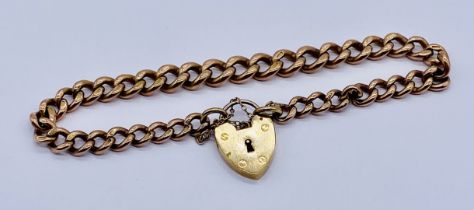 A 9ct rose gold bracelet with a 9ct yellow gold padlock, total weight 19.8g