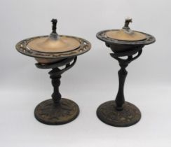 A matched pair of oil lamps, with brass wells - height of tallest: 39cm