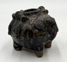 A small Khmer pottery jar in the form of an elephant with globular body supported on four legs -